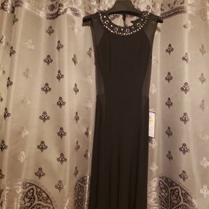 NWT. Beautiful Black Dress with Embellished Neckline. Fits 7/8